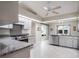 Well-lit kitchen features a gas range, stainless steel appliances, and ample counter space at 26800 Racquet Cir, Leesburg, FL 34748