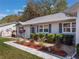Charming landscaping details along the walkway leading to the front door, adding a touch of elegance at 26800 Racquet Cir, Leesburg, FL 34748