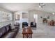 Spacious living room with vaulted ceilings, neutral paint, and modern furniture at 26800 Racquet Cir, Leesburg, FL 34748