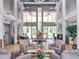 Welcoming community lobby featuring comfortable seating, soaring ceilings, and a bright atmosphere at 26800 Racquet Cir, Leesburg, FL 34748