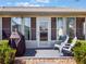 Relaxing screened patio with a grill and furniture, perfect for outdoor entertaining or peaceful evenings at 26800 Racquet Cir, Leesburg, FL 34748