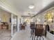 Spacious sunroom featuring sliding glass doors and neutral decor at 26800 Racquet Cir, Leesburg, FL 34748
