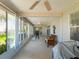 Spacious sunroom featuring an open floor plan and neutral decor at 26800 Racquet Cir, Leesburg, FL 34748