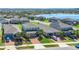 Aerial view of a neighborhood featuring many two-story homes with well-maintained lawns at 3054 Hill Point St, Minneola, FL 34715