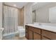 Bathroom featuring a shower-tub combo, toilet, and vanity with a sink at 3054 Hill Point St, Minneola, FL 34715