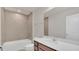 Bathroom featuring a tub and shower combination, a white sink and cabinets at 3054 Hill Point St, Minneola, FL 34715