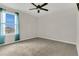Bedroom features a window with curtains and neutral carpet at 3054 Hill Point St, Minneola, FL 34715