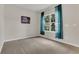 Bedroom featuring a window with curtains and neutral-toned walls at 3054 Hill Point St, Minneola, FL 34715