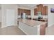 Kitchen with a granite island, stainless steel appliances, and plenty of cabinet space at 3054 Hill Point St, Minneola, FL 34715