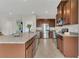 Stylish kitchen with stainless steel appliances, granite countertops, and dark wood cabinetry at 3054 Hill Point St, Minneola, FL 34715