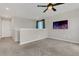 Spacious loft with a ceiling fan and wall-mounted television at 3054 Hill Point St, Minneola, FL 34715