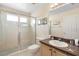 A clean bathroom with a glass-enclosed shower and modern fixtures at 306 Orista Dr, Davenport, FL 33897