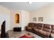 Comfortable living room features a plush sofa, and wood flooring at 306 Orista Dr, Davenport, FL 33897