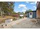Backyard featuring wood deck, above ground pool, storage building, and landscaping at 33311 Green Rd, Leesburg, FL 34788