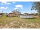 Spacious yard with above ground pool and mature trees at 33311 Green Rd, Leesburg, FL 34788