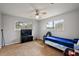 Bedroom features neutral walls, two windows and stylish ceiling fan fixture at 33311 Green Rd, Leesburg, FL 34788