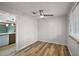 Dining room with light grey walls, wood-look floors, ceiling fan, and natural light at 33311 Green Rd, Leesburg, FL 34788