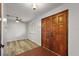 Open entry with wood look flooring, ceiling fan, large front door, and bright natural light at 33311 Green Rd, Leesburg, FL 34788