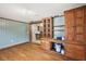 Spacious room with wood floors, custom cabinets and built-ins, perfect for storage and organization at 33311 Green Rd, Leesburg, FL 34788