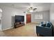 Bright living room with light parquet floors, a ceiling fan, and a comfortable blue sofa at 33311 Green Rd, Leesburg, FL 34788