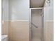 Shower stall enclosed by tiled walls and a translucent sliding door at 33311 Green Rd, Leesburg, FL 34788