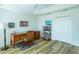 Bright office space featuring a classic wood desk, shelving unit, and neutral wall colors at 3346 Wise Way, The Villages, FL 32163