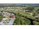 Aerial view showcasing the home's proximity to a golf course and scenic lakes at 341 Ranchwood Dr, Leesburg, FL 34748