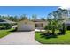 Charming single story home with well-maintained lawn and brick driveway at 341 Ranchwood Dr, Leesburg, FL 34748