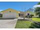 Charming single-story home with a well-maintained lawn and an attached two-car garage at 341 Ranchwood Dr, Leesburg, FL 34748