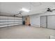 Spacious two car garage has sealed floors and ceiling fan at 341 Ranchwood Dr, Leesburg, FL 34748