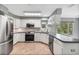 Well-equipped kitchen with stainless steel appliances and modern finishes at 341 Ranchwood Dr, Leesburg, FL 34748