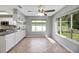 Eat-in kitchen with stainless steel appliances, custom cabinetry, and natural lighting at 341 Ranchwood Dr, Leesburg, FL 34748