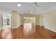 Bright living room boasts vaulted ceilings, ceiling fans, and hardwood flooring at 341 Ranchwood Dr, Leesburg, FL 34748