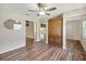 Large main bedroom with hardwood floors, built-in armoire and mirrored closets at 341 Ranchwood Dr, Leesburg, FL 34748