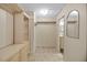 Large walk-in closet featuring shelving, hanging space, and mirrors, perfect for organization and storage at 341 Ranchwood Dr, Leesburg, FL 34748