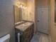 This bathroom features a vanity with marble countertop and tiled floors at 351 Groveland Rd, Mount Dora, FL 32757