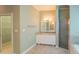 Bathroom featuring tile floors, white cabinets and granite counters, and walk-in shower at 351 Groveland Rd, Mount Dora, FL 32757