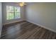 Bedroom with hardwood floor and natural lighting and ceiling fan at 351 Groveland Rd, Mount Dora, FL 32757