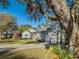 Charming single-story home with well-maintained lawn, mature landscaping, and an attached two-car garage at 351 Groveland Rd, Mount Dora, FL 32757