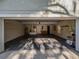 Spacious two car garage with storage cabinets, workbench, and room for parking at 351 Groveland Rd, Mount Dora, FL 32757