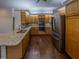 Elegant kitchen featuring stainless steel appliances, granite countertops, and ample cabinet space at 351 Groveland Rd, Mount Dora, FL 32757