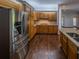 Open concept kitchen features stainless steel appliances, gas range and expansive cabinetry at 351 Groveland Rd, Mount Dora, FL 32757