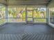 Relaxing screened in back porch with wood decking and natural views at 351 Groveland Rd, Mount Dora, FL 32757