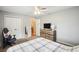 Comfortable bedroom with neutral walls, two windows, ceiling fan, and carpet flooring at 3909 Cr 532A, Bushnell, FL 33513