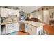 Well-equipped kitchen with stainless steel appliances and ample counter space open to the living room at 3909 Cr 532A, Bushnell, FL 33513