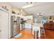 Bright kitchen features stainless steel appliances, breakfast bar, and open floor plan at 3909 Cr 532A, Bushnell, FL 33513