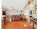 Bright living room with hardwood floors, comfortable seating, and plenty of natural light, perfect for relaxation at 3909 Cr 532A, Bushnell, FL 33513