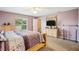 Bright main bedroom with ensuite bathroom, comfortable carpet, and natural light at 3909 Cr 532A, Bushnell, FL 33513