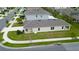 An aerial view of this property including the green yard, patio area, and beige stucco exterior at 412 Lady Bella Pl, Deland, FL 32724