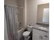 Fresh bathroom showcasing shower with tub, granite countertop, and vanity with large mirror at 412 Lady Bella Pl, Deland, FL 32724